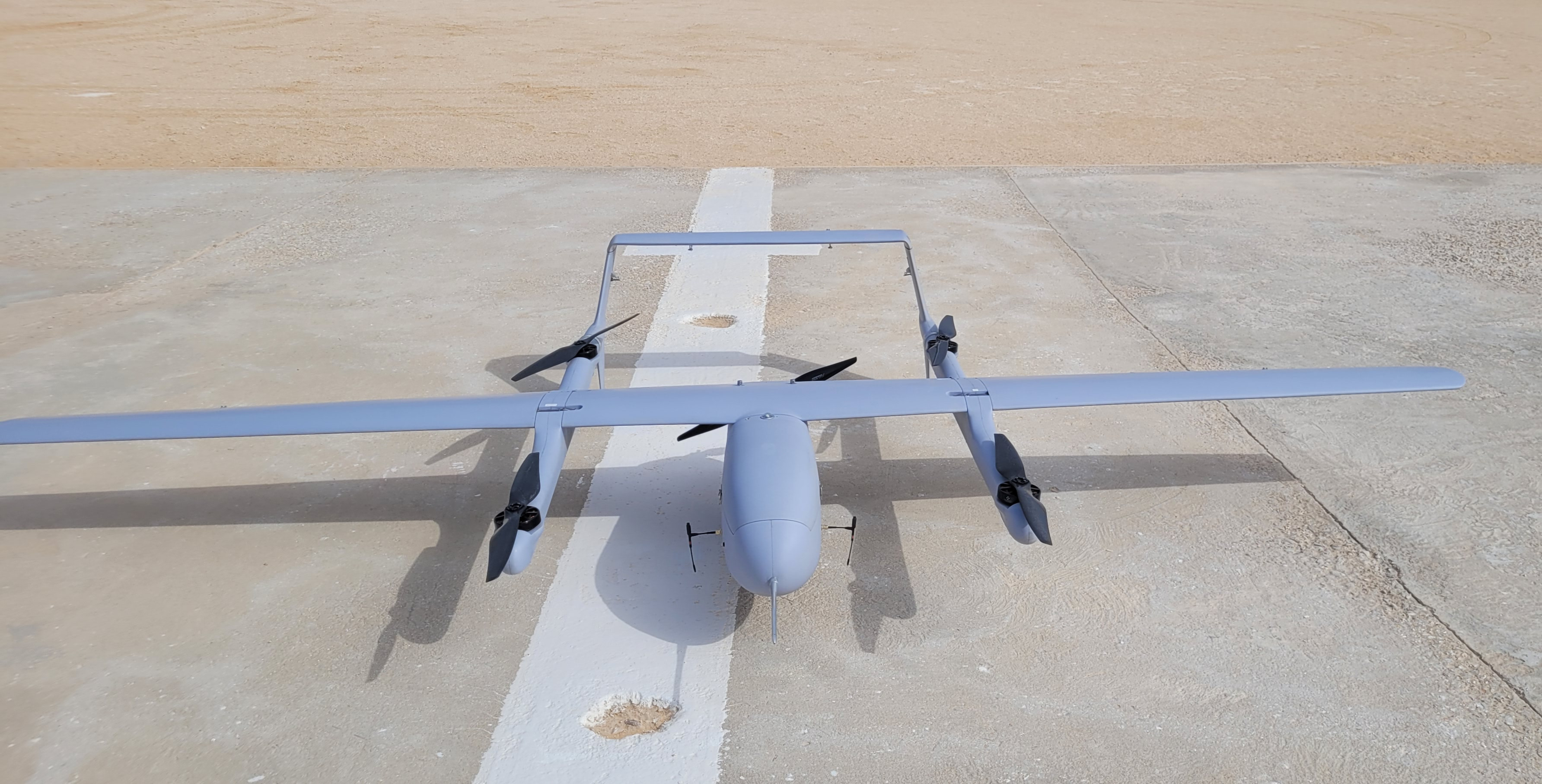 Fixed-wing VTOL UAS on runway