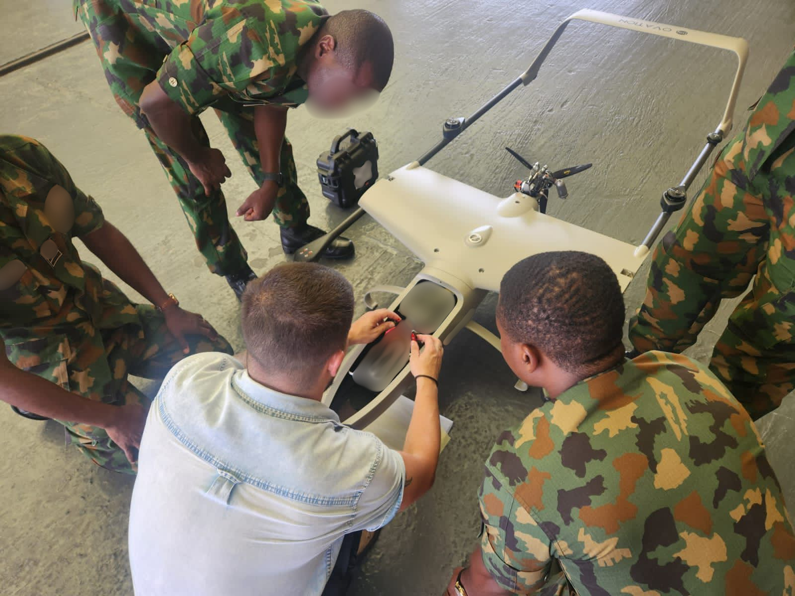 Technical team working on UAS with military